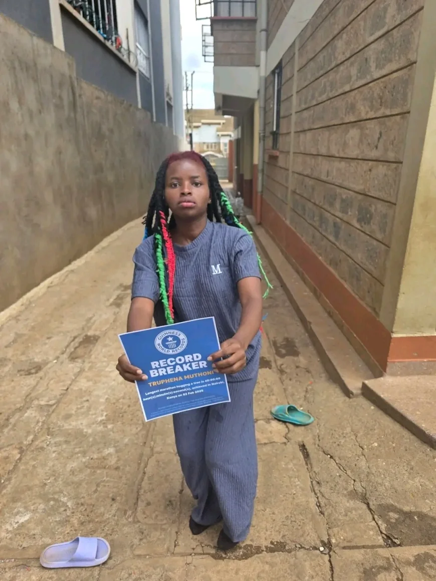 Truphena Muthoni receives Guinness World Records badge after hugging a tree for 48 hours